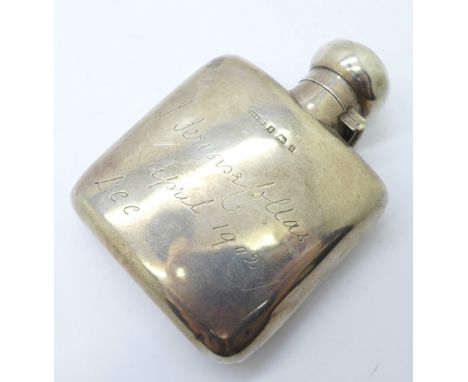 A small silver flask, Birmingham 1900, with inscription dated 1902, 81g, height 93mm, some dents 