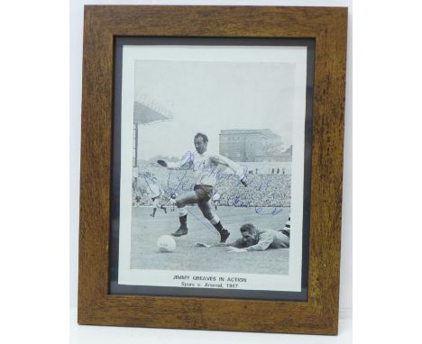 A framed signed black and white print of Jimmy Greaves playing for Tottenham versus Arsenal 