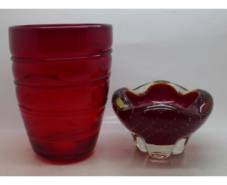 A Whitefriars ruby red glass controlled bubble bowl and a red glass vase 