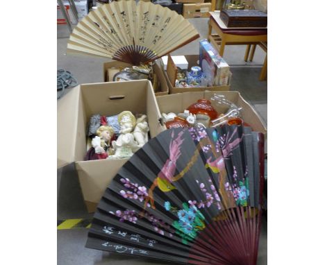 Four boxes of household items, clocks, oil lamp glass shades and chimneys, figures, mixed china, dolls, etc. **PLEASE NOTE TH