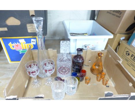 A large heavy crystal decanter and two glasses with ruby flash cut decoration, a Thomas Webb crystal decanter and two whisky 
