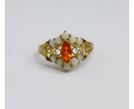 A 9ct gold, opal and orange stone ring, (possibly fire opal), 1.9g, O 