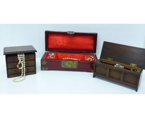 Three wooden jewellery boxes; a Chinese box with carved green soapstone discs set in the lid with padlock and key, a vintage 