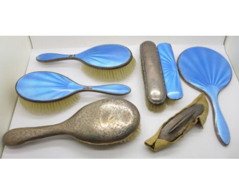 A silver and blue enamel hand mirror and three similar brushes, some enamel a/f, two other silver backed mirrors and a nail b