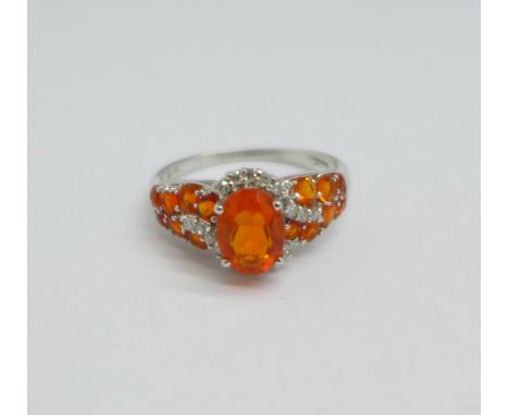 A 9ct gold, diamond and orange stone dress ring, 2.6g, O 