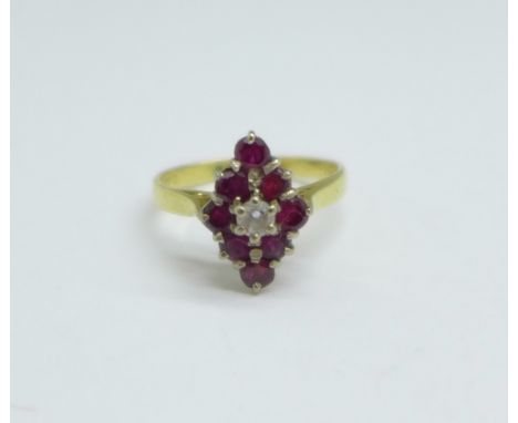 An 18ct gold, ruby and white stone ring, 3.2g, L/M 