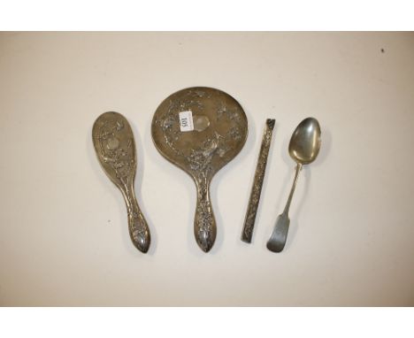 A Chinese white metal three piece dressing table set decorated with birds amongst foliage  AF; and a silver plated serving sp