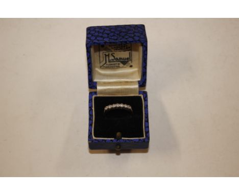 An 18ct gold diamond ring set with a row of seven diamonds