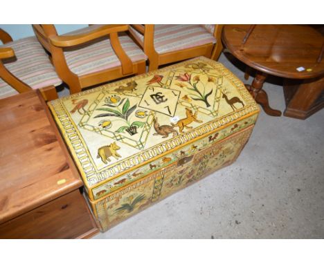 A painted and decorated dome topped trunk depicting various animals and dated 1971