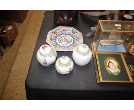 Three Chinese ginger jars and covers; and an oriental octagonal shaped plate