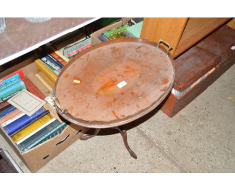 An Edwardian mahogany oval tray raised on tripod stand 