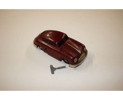 A Gescha West German tin plate wind-up toy car with key