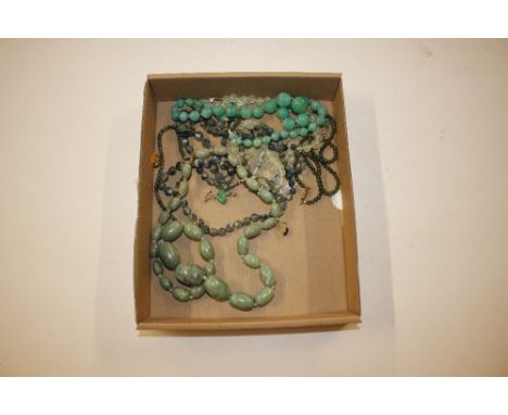 A collection of jade and other hardstone jewellery including graduated necklaces and ear-rings