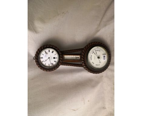 An Edwardian oak aneroid barometer by H Hughes & Son, Fenchurch Street, London, with thermometer and clock