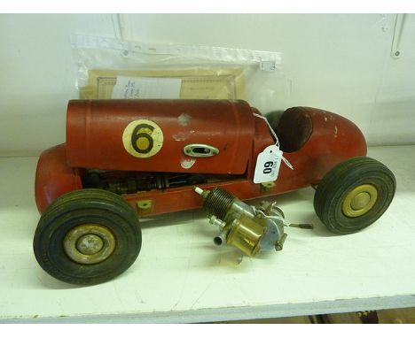 A 1940s scratch built model of a 1930s racing car made by Miss Rome Magdalena Morgan having removable bonnet, spare engine, p