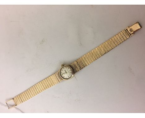 A 1960s lady's Omega dress watch with 375 market gold bracelet