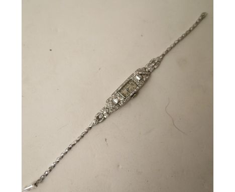 An art deco platinum and diamond set cocktail watch housing a Swiss 17 jewel manual wind movement