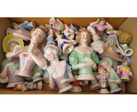 A selection of early 20th century and later porcelain pin cushion dolls