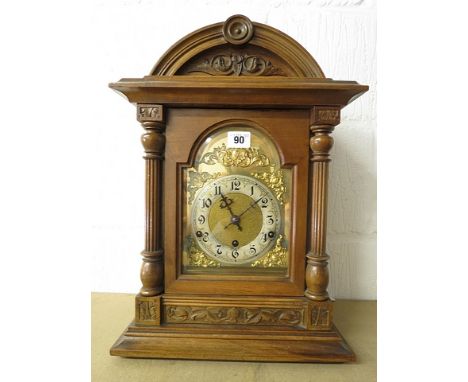 Late 19th/early 20th century German mantel clock, carved mahogany case fronted by fluted and turned columns, gilt dial with s