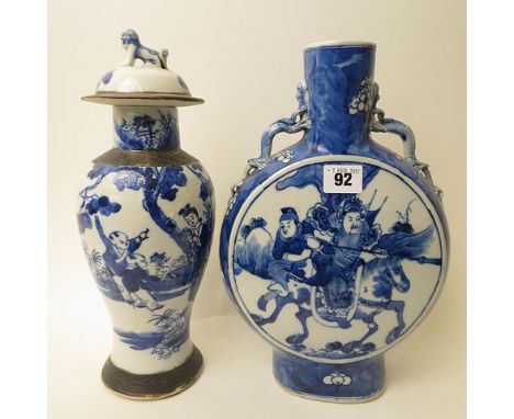 Chinese late 19th/early 20th century blue and white porcelain moon flask decorated with a warrior on horseback to front and b