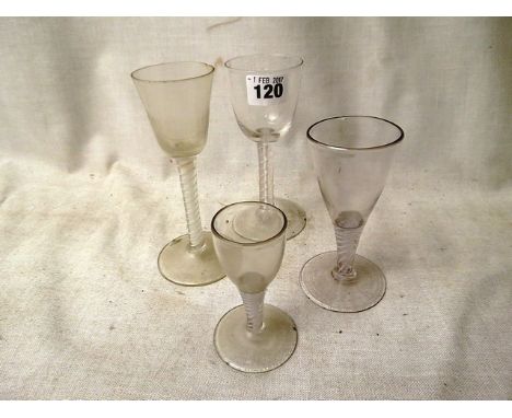 Three Georgian opaque twist wine glasses to include one having a round funneled bowl on a plain stem, having a single opaque 