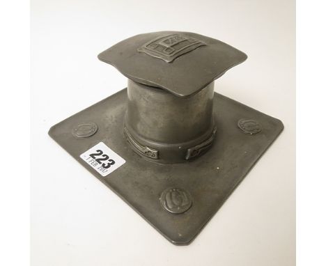 A Liberty's Tudric pewter inkwell designed by Archibald Knox with a porcelain liner, stamped Tudric 0141 to the base, 6 x 3