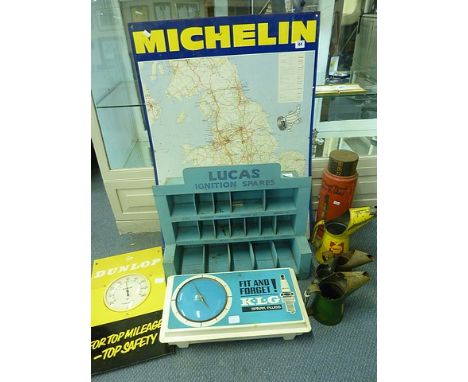 A Michelin sign depicting 1970s map of Great Britain, Lucas Ignition spares, wall shelf, Schrader tyre gauge, oil jugs etc