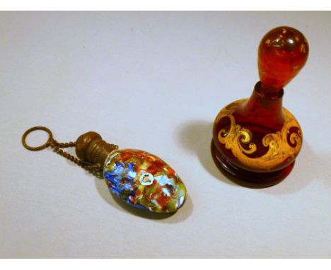 OVAL GLASS SCENT BOTTLE WITH GLASS CANE FACES AND CHATELAINE'S CHAIN AND A SMALL RUBY FLASH GLASS BOTTLE (H: 9 cm) [2]