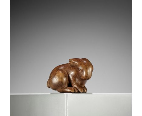 A KYOTO SCHOOL WOOD NETSUKE OF A HAREUnsignedJapan, Kyoto, 19th century, Edo period (1615-1868)The rabbit (usagi) finely carv