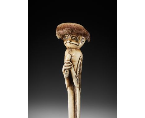 A SUPERB STAG ANTLER OBI HASAMI NETSUKE OF A KAPPA WITH CUCUMBER, ATTRIBUTED TO KOKUSAIAttributed to Ozaki Kokusai (1835-1892