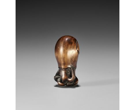 YOSUI: A RARE WOOD NETSUKE OF A SQUIDBy Yosui, signed Yosui 陽水Japan, 19th century, Edo period (1615-1868)Finely carved as a s