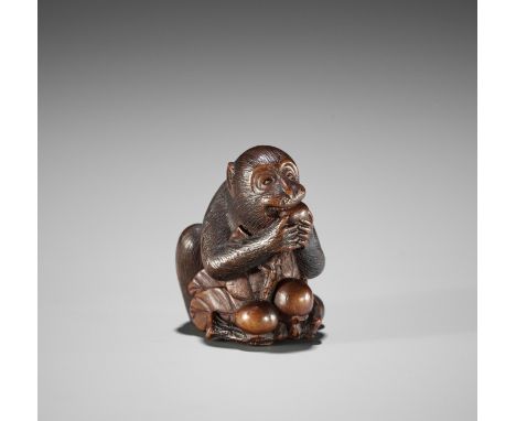 MASANAO: A FINE WOOD NETSUKE OF A MONKEY EATING PERSIMMONSBy Masanao, signed Masanao 正直Japan, Ise-Yamada, mid-19th century, E