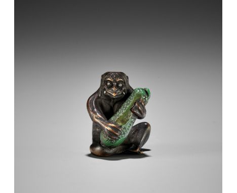 JUGYOKU: A RARE WOOD AND STAG ANTLER NETSUKE OF A KAPPA PLAYING THE CUCUMBERBy Ryukosai Jugyoku, signed Jugyoku 寿玉Japan, Edo 