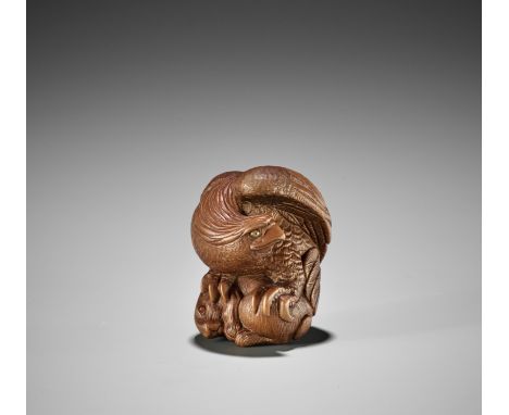 BISHU: A FINE CONTEMPORARY WOOD NETSUKE OF AN EAGLE SNATCHING A RABBITBy Katsutoshi Saito (Bishu, born 1943), signed Kenyosai