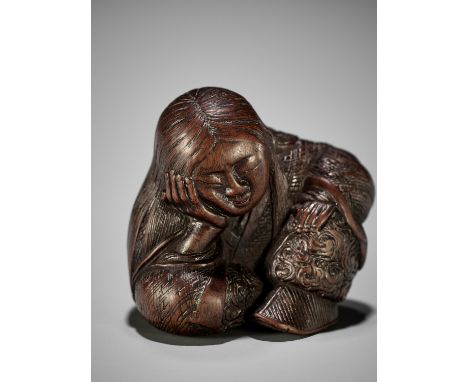 TADATOSHI: A SUPERB NAGOYA SCHOOL WOOD NETSUKE OF A SEATED SLEEPING SHOJOBy Tadatoshi, signed Tadatoshi 忠利Japan, Nagoya, earl
