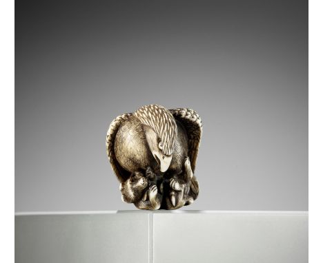 TOMOCHIKA: AN IVORY NETSUKE OF AN EAGLE SNATCHING A FOXBy a member of the Tomochika school, signed Tomochika 友親Japan, Edo (To