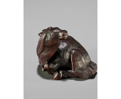 IKKAN: A FINE NAGOYA SCHOOL WOOD NETSUKE OF A RECUMBENT HORSEBy Ikkan (1817-1893), signed Ikkan 一貫Japan, Nagoya, mid-19th cen