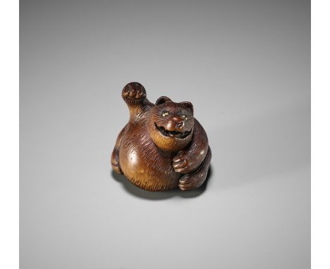 A WOOD NETSUKE OF A TANUKI NO HARA TSUZUMI, AFTER MINKOAfter Tanaka Juntoku Minko, Minko 珉江 shaJapanFinely carved as a tanuki