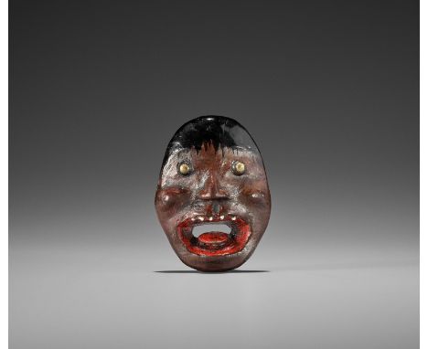 AN UNUSUAL LACQUERED WOOD REVERSIBLE MASK NETSUKE OF A MONSTROUS HEADJapan, 19th century, Edo period (1615-1868)Exhibited: Bo