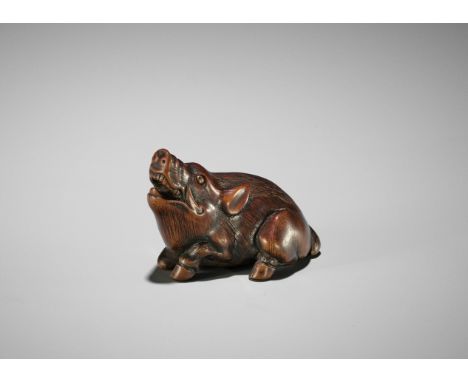 TSUNENORI: A SUPERB TANBA SCHOOL WOOD NETSUKE OF A RECUMBENT BOARBy Tsunenori, signed Tsunenori 恒 示Japan, Tanba province, c. 