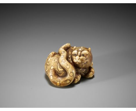 A POWERFUL OSAKA SCHOOL IVORY NETSUKE OF A CROUCHING TIGERUnsignedJapan, Osaka, early 19th century, Edo period (1615-1868)Pub