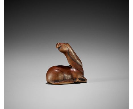 A VERY RARE WOOD NETSUKE OF A GIRAFFEUnsignedJapan, late 18th to early 19th century, Edo period (1615-1868)The horse-like ani