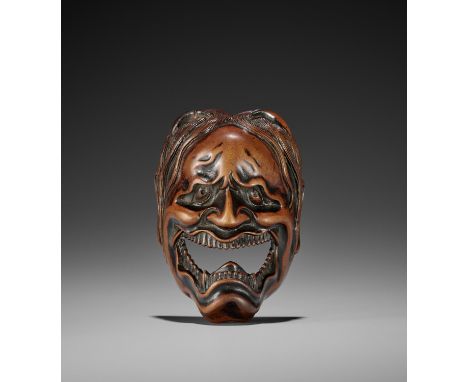 A SPECTACULAR AND LARGE WOOD MASK NETSUKE OF A FEMALE DEMONUnsigned Japan, 18th century, Edo period (1615-1868)An exceptional