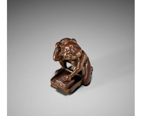 DEME: A RARE AND UNUSUAL EDO SCHOOL WOOD NETSUKE OF A BLIND RAT CATCHERBy a member of the Deme family, signed Deme 出目Japan, E