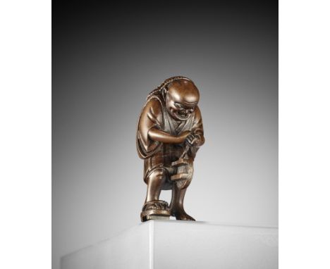 A WOOD NETSUKE OF THE OIL THIEF, ATTRIBUTED TO MASAYOSHIUnsignedJapan, Nagoya, 19th century, Edo period (1615-1868)Well carve