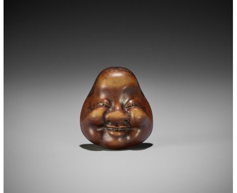 GYOKKO: A WOOD MASK NETSUKE OF OKAMEBy Gyokko, signed Gyokko 玉后Japan, Edo (Tokyo), late 18th to early 19th century, Edo perio
