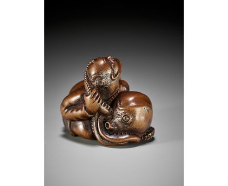 A FINE EDO SCHOOL WOOD NETSUKE OF ARIOMARU STRUGGLING WITH AN OCTOPUSUnsignedJapan, Edo (Tokyo), 19th century, Edo period (16