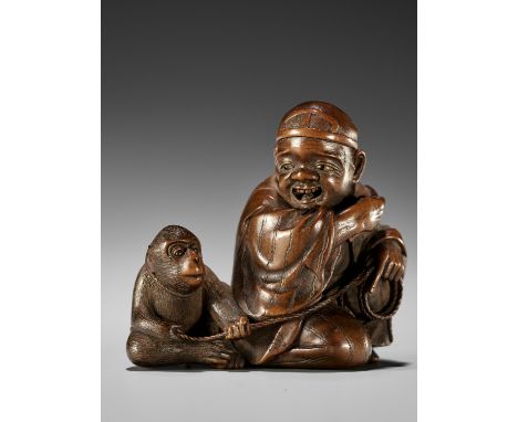 HOKYUDO ITSUMIN: A SUPERB WOOD NETSUKE OF A SARUMAWASHI AND MONKEYBy Hokyudo Itsumin, signed Itsumin o 逸民翁 Japan, Edo (Tokyo)