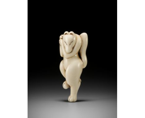 AN EARLY IVORY NETSUKE OF A DANCING KITSUNEUnsignedJapan, early 18th century, Edo period (1615-1868)Carved as a kitsune (fox)