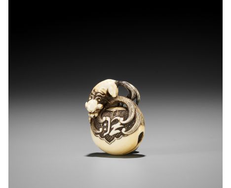 A FINE IVORY NETSUKE OF A SHISHI ON MOKUGYOUnsignedJapan, Tokyo, Asakusa district, second half of 19th centuryA cleverly carv